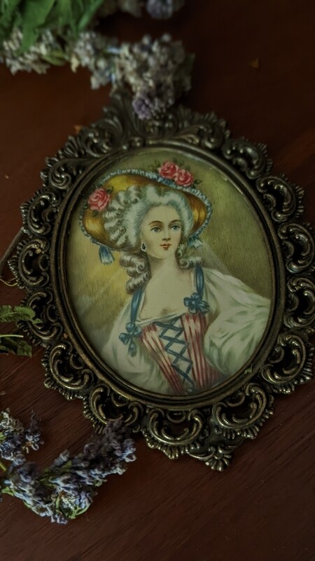ornate frame lady