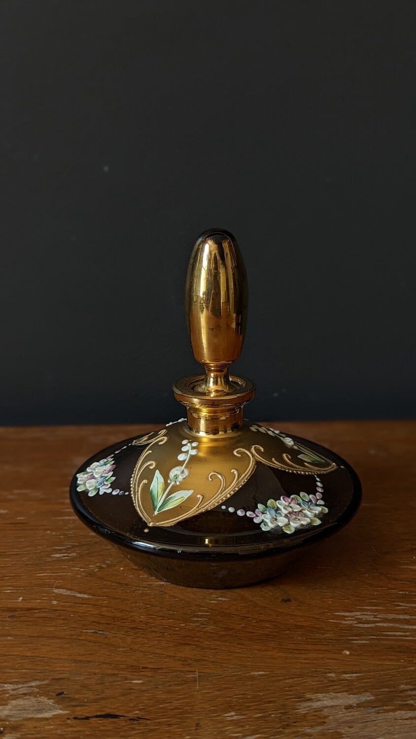 Floral gold perfume bottle