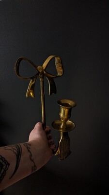 Brass bow candle holder