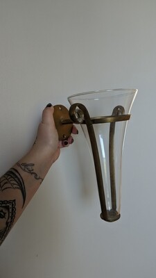 Glass wall vase with brass support