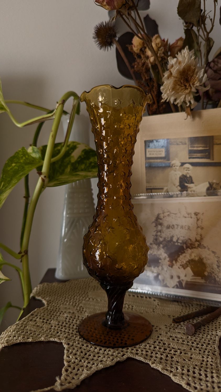 Amber footed bud vase with star pattern