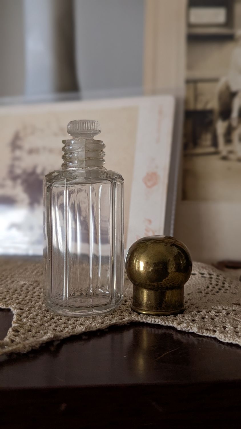 Perfume bottle with gold cap