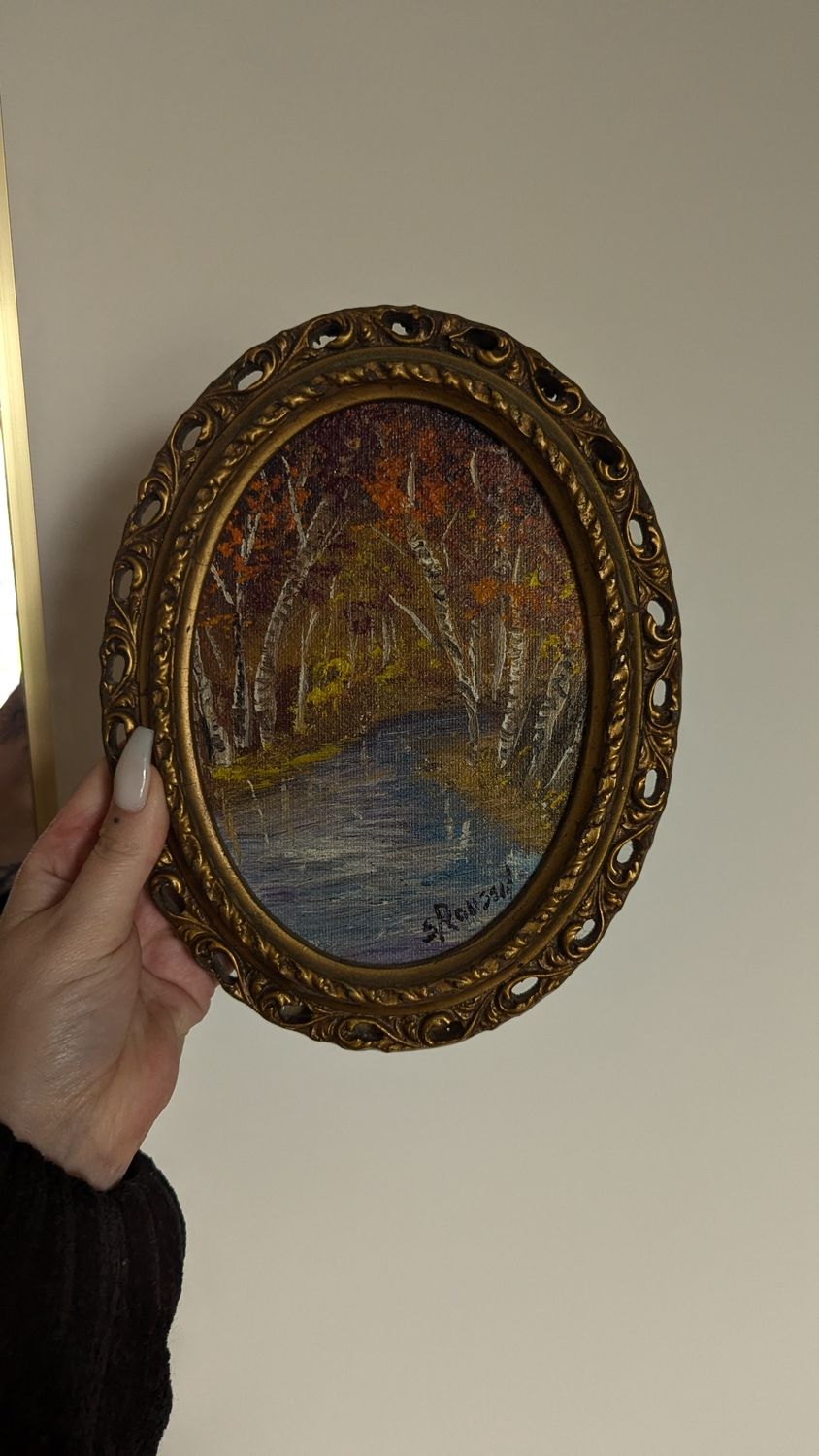 Small painting in ornate frame
