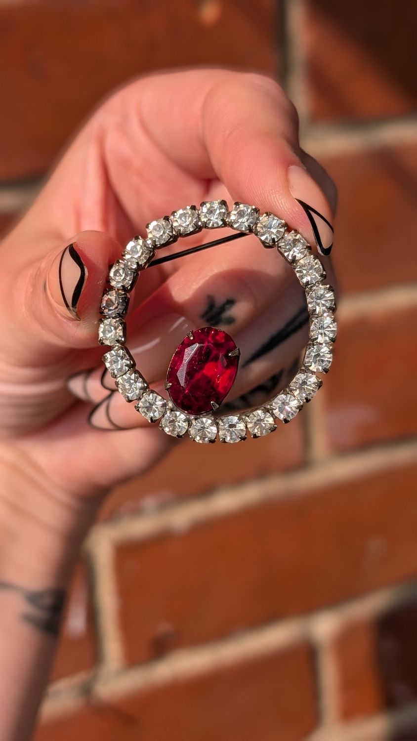 Red jewel vintage circular brooch