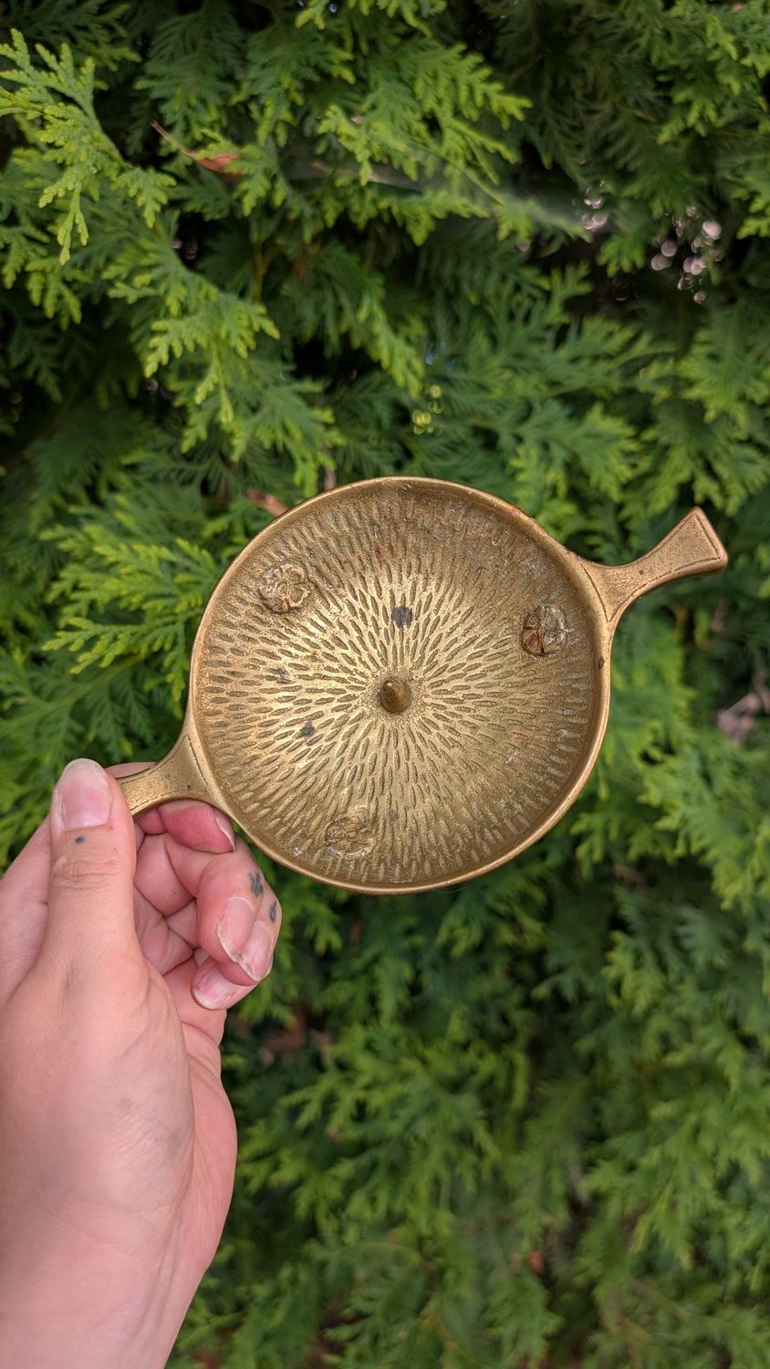 Flat brass candle holder