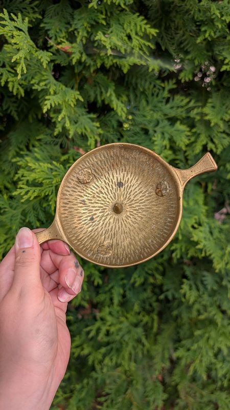 Flat brass candle holder