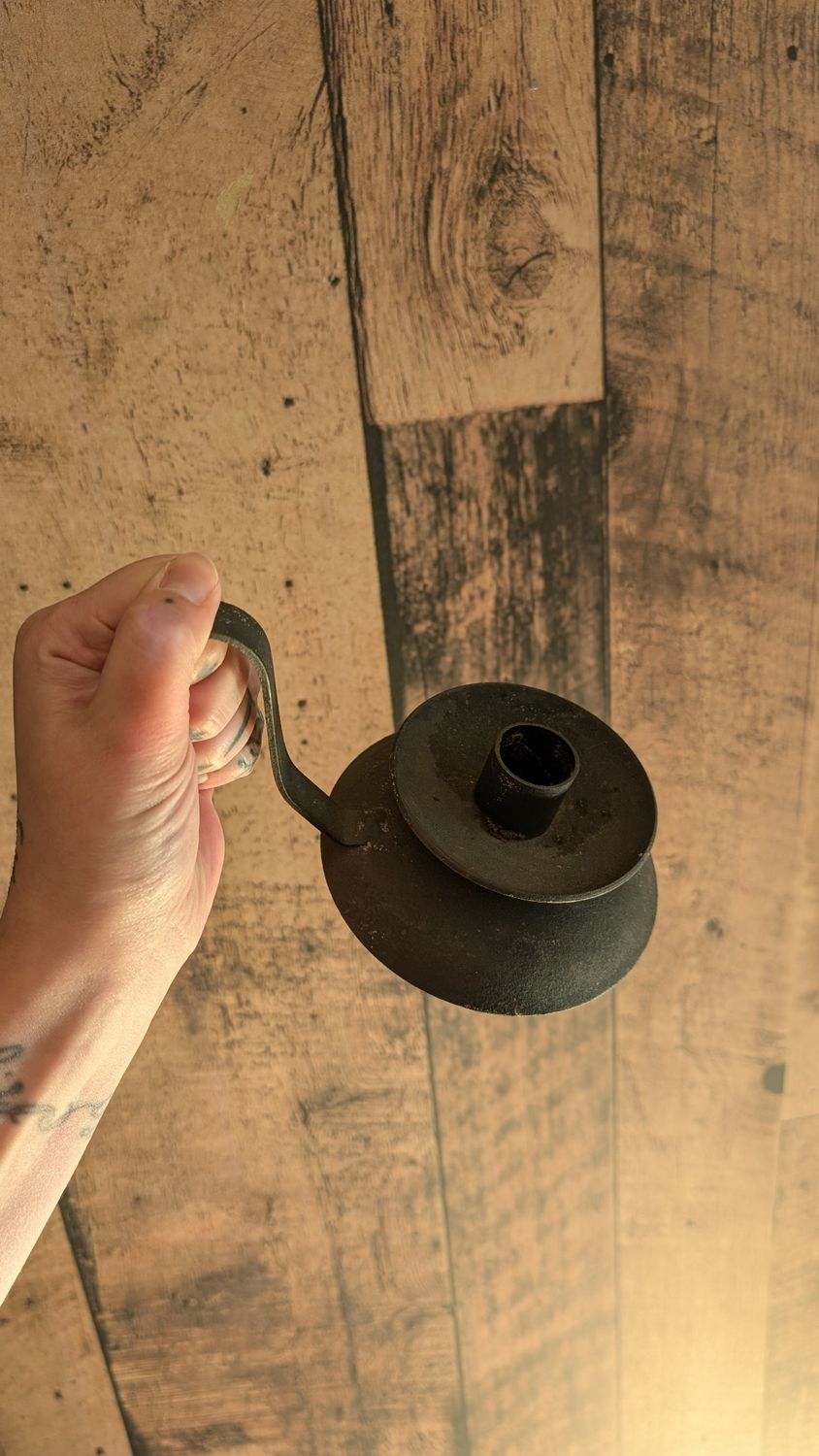 Small black iron primitive candle holder