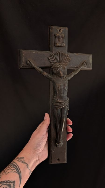 Black coffin metal crucifix