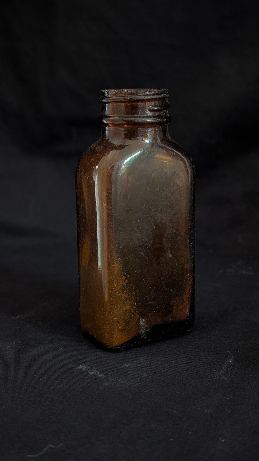 Amber colored glass bottle vintage