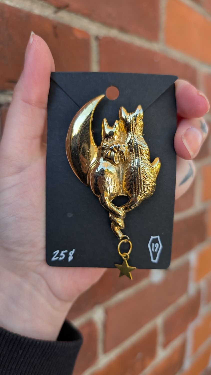Two cats on moon brooch