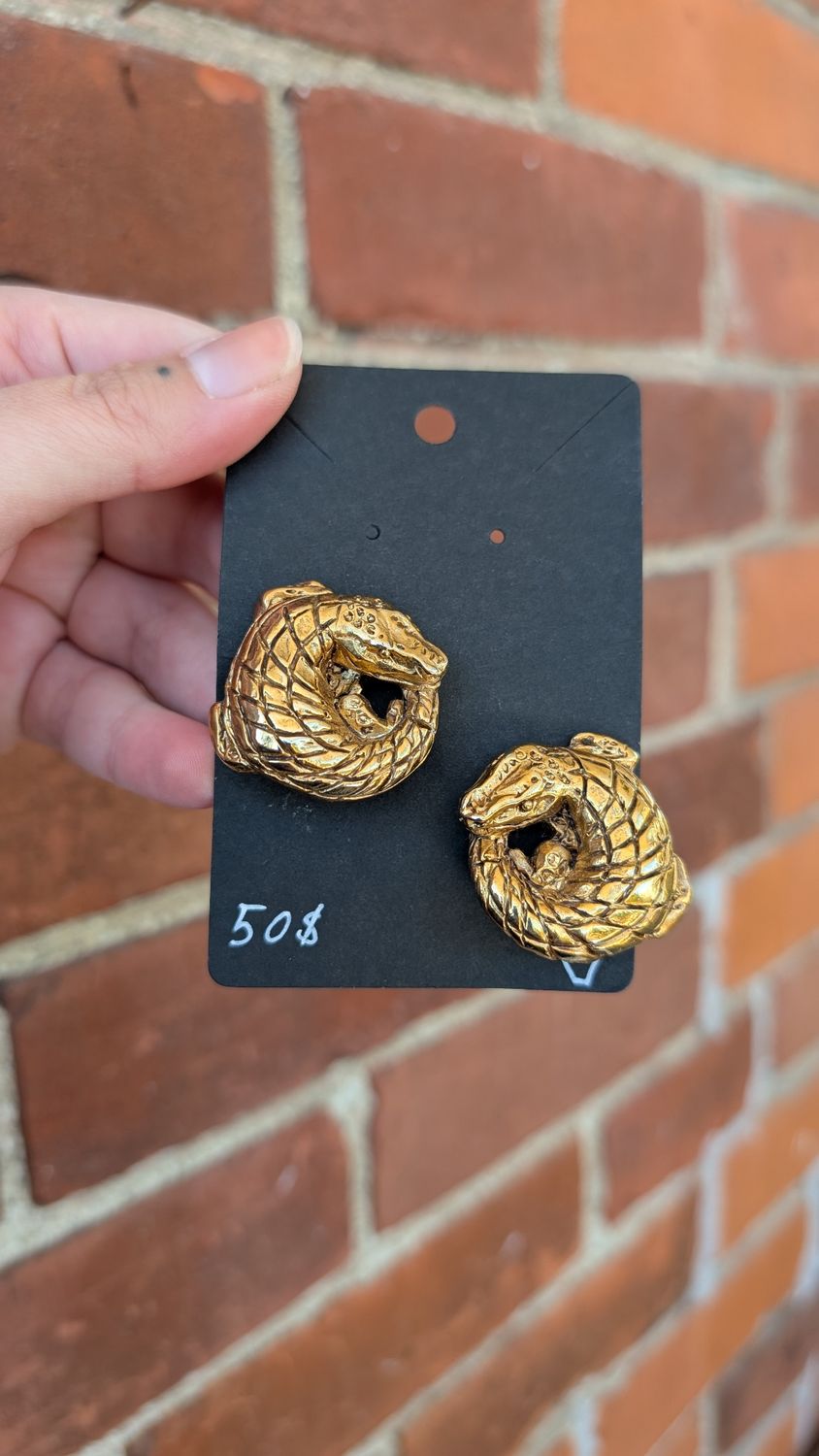 Gold colored gators clip earrings