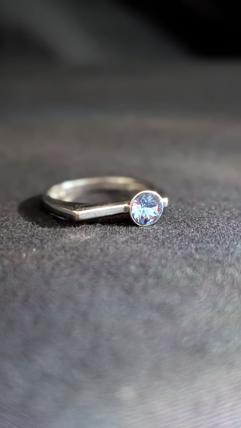 Sterling silver ring with light blue gemstone in size 8