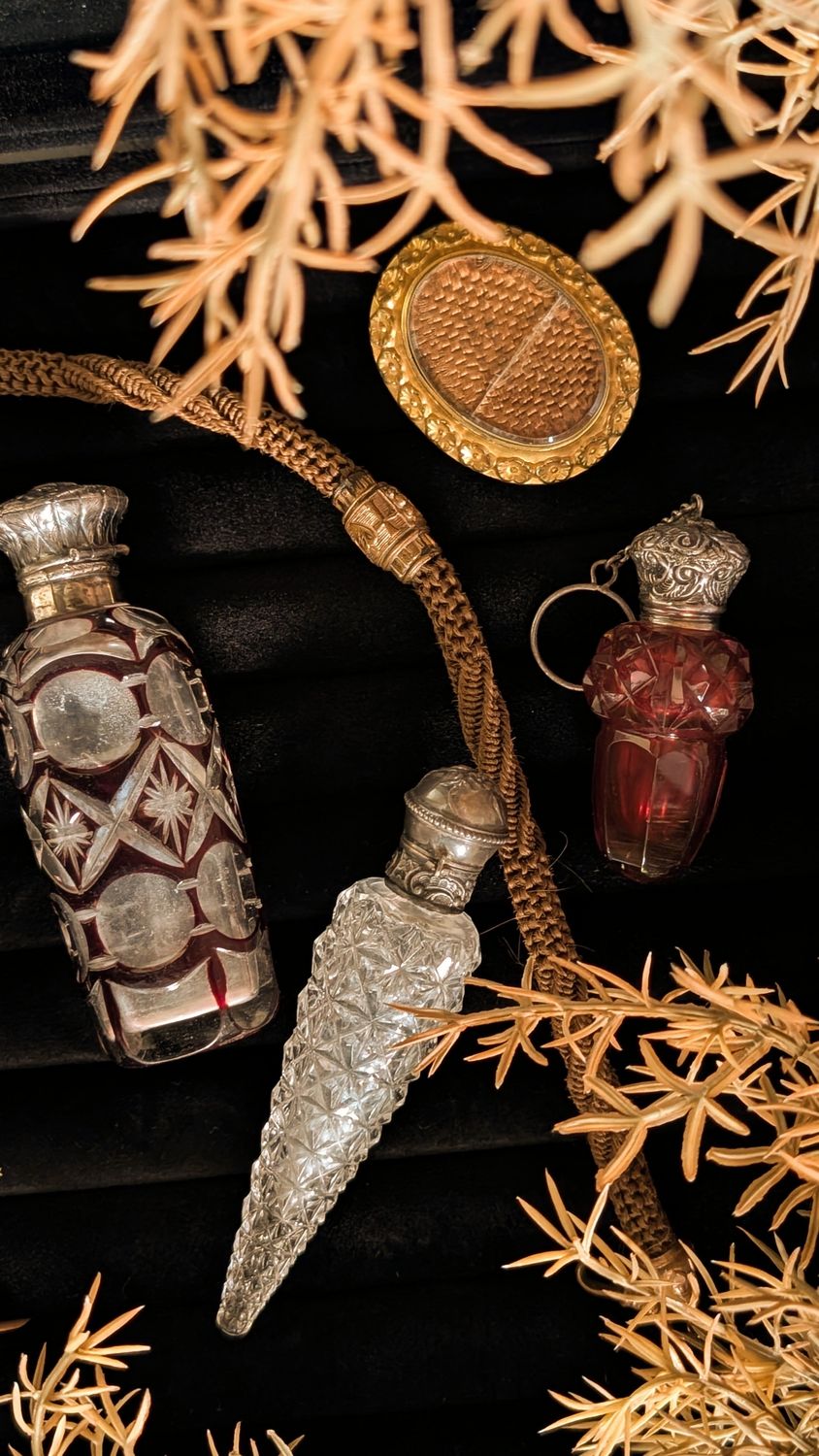 Red glass small silver cap perfume bottle