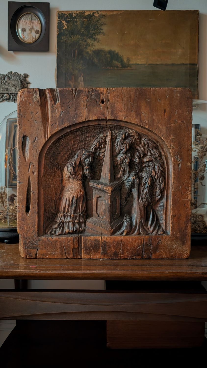 Carved wood panel - grief