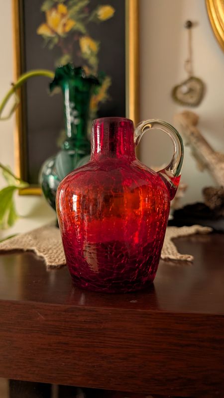 Small red cracked glass pitcher