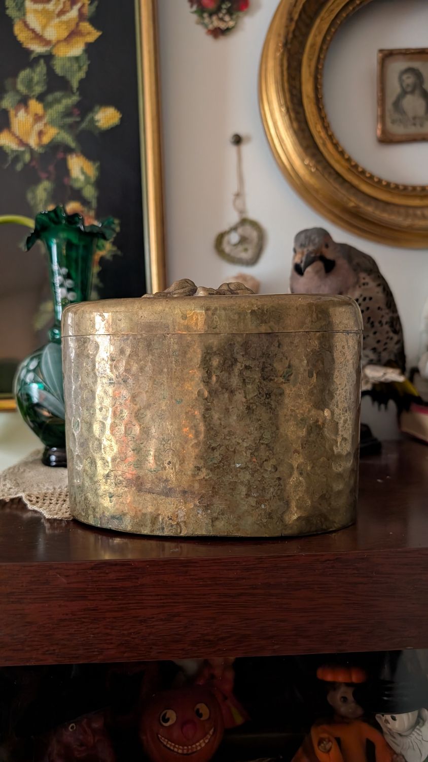 Vintage brass embossed tobacco box with roses on lid