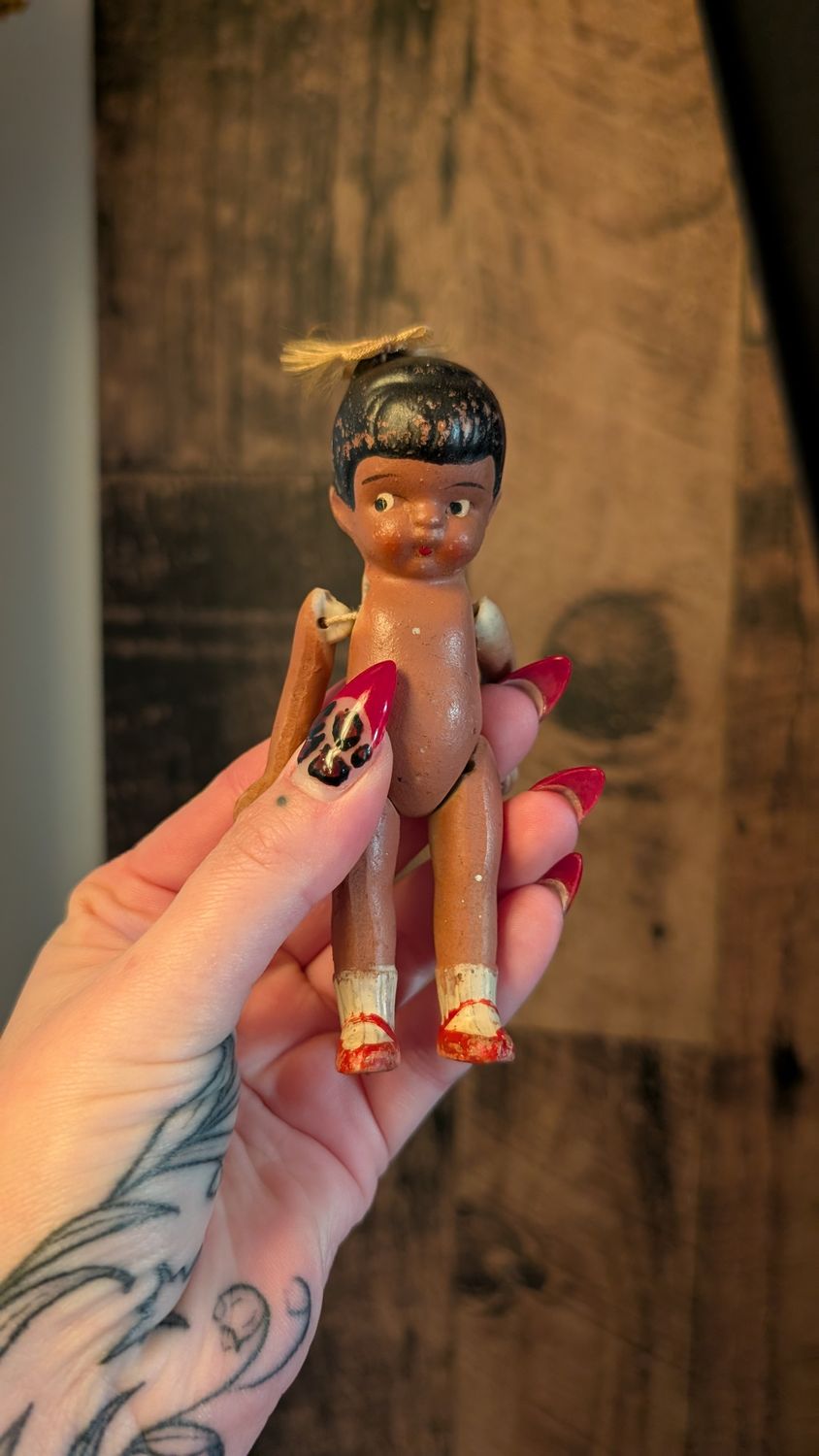 Small jointed bisque doll