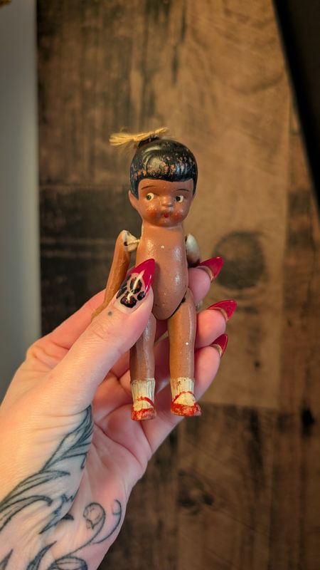 Small jointed bisque doll