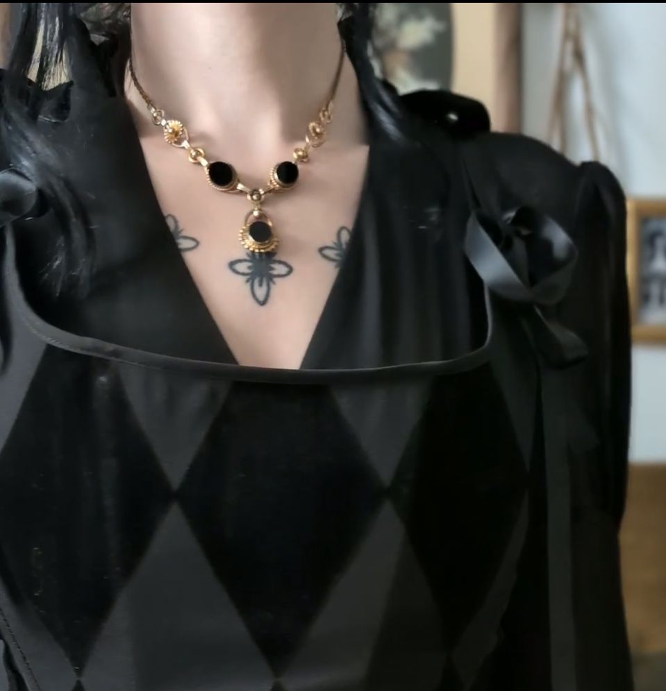 Costume jewelry necklace with black onyx glass stone