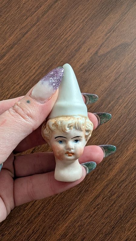 Cone hat doll head