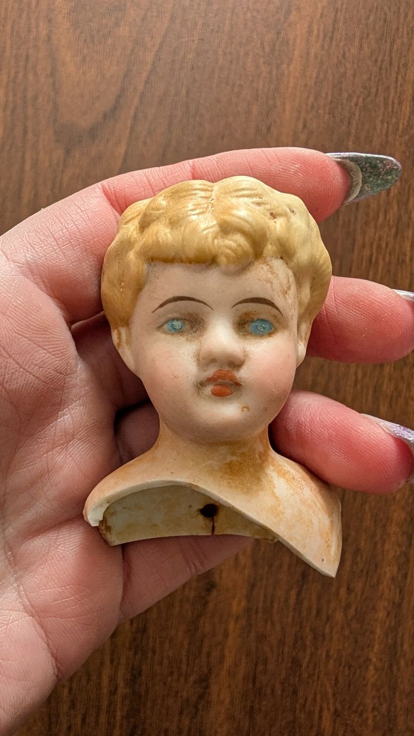 Cherub like porcelain head