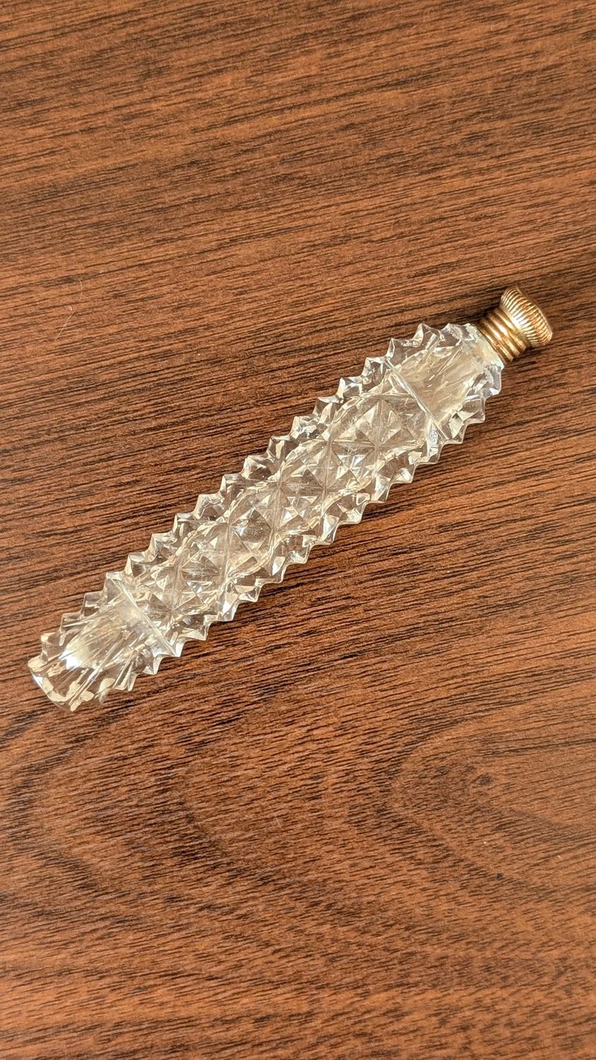Vintage glass tear catcher perfume bottle with golden cap