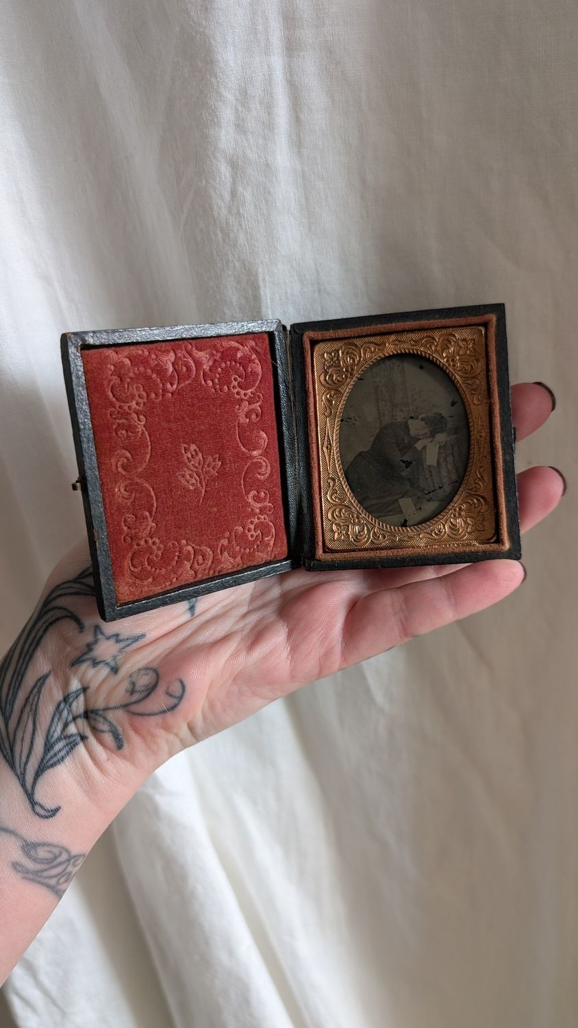 Tin type in case of leaning woman - she is smiling - love letters