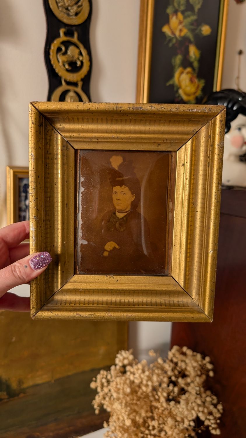 Woman portrait in antique domed glass wood frame