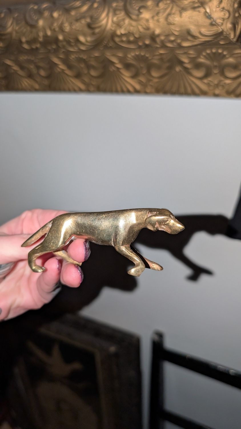 Miniature brass irish setter hunting dog pointer