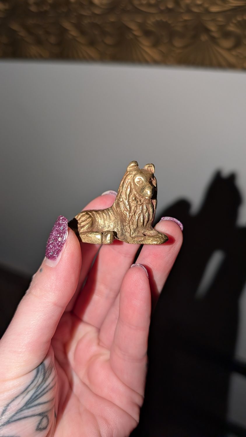 Miniature brass lion