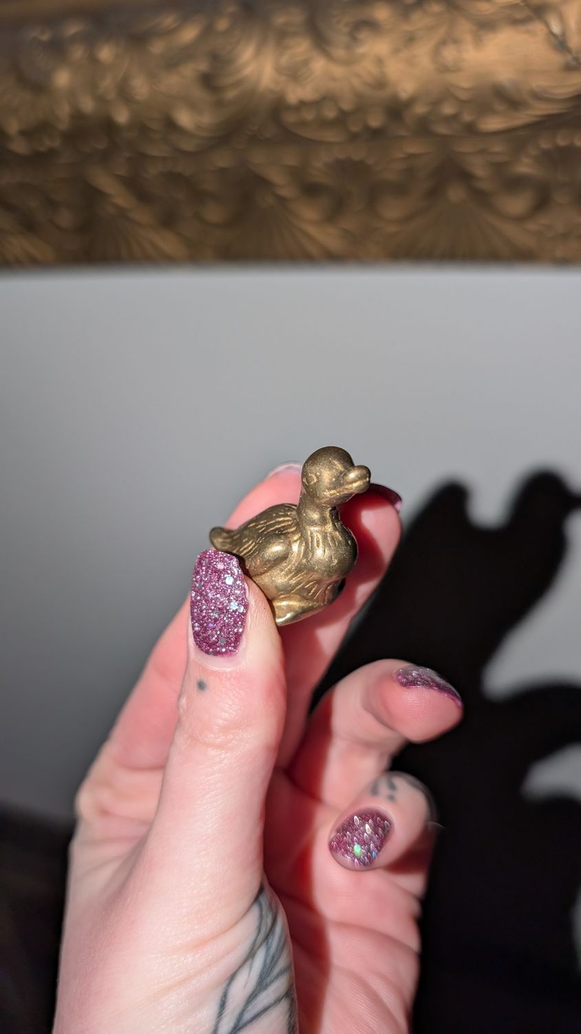 Miniature brass duck