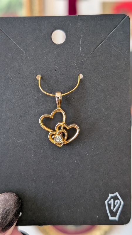 Three hearts gold tone pendant