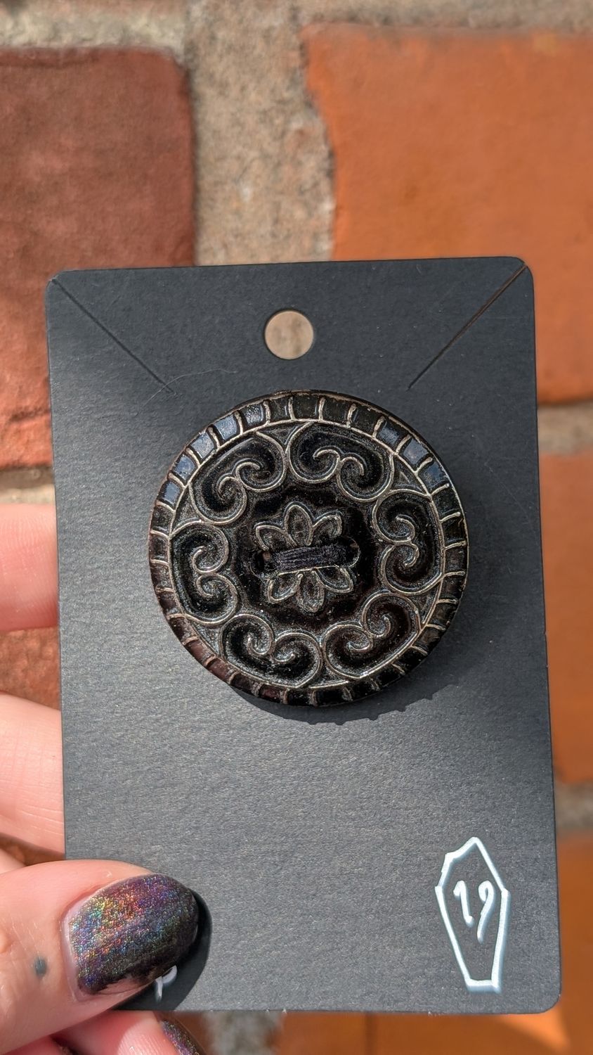 Victorian button set as a brooch