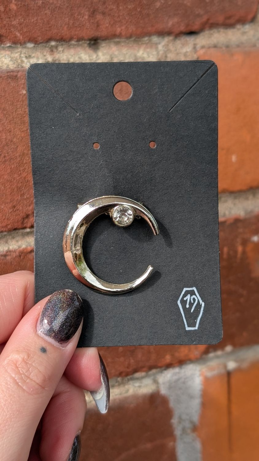 Small silver tone moon crescent brooch