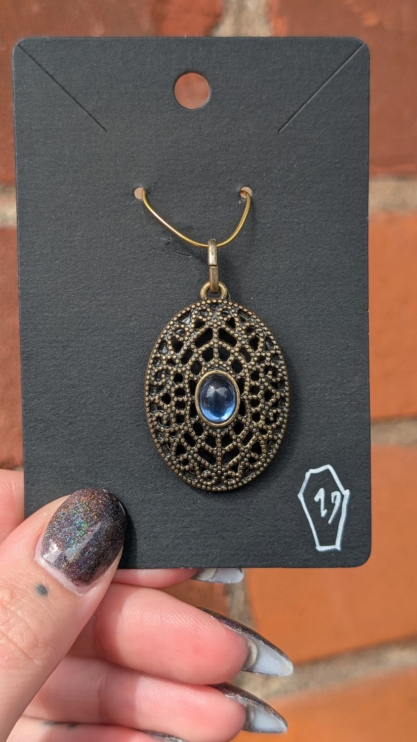 Blue stone bronze tone ornate pendant