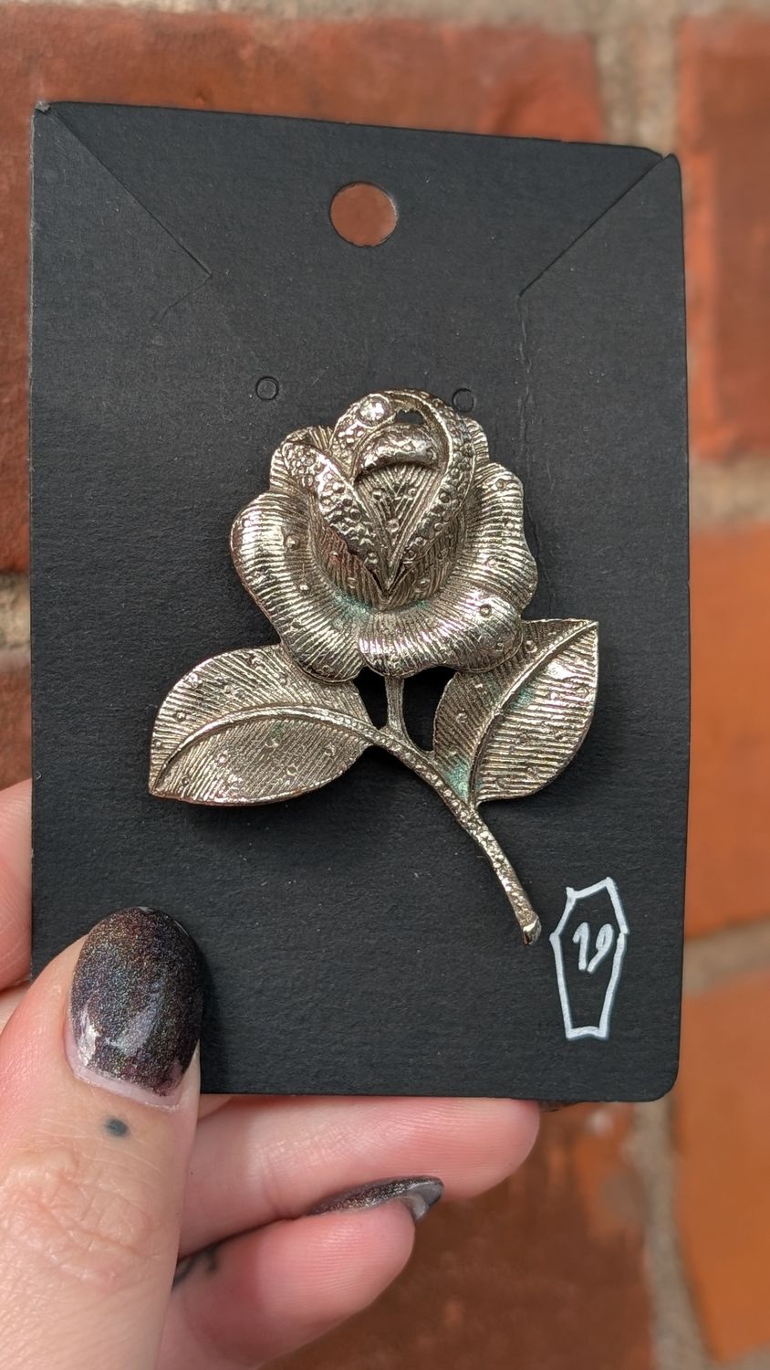 Silver tone rose brooch