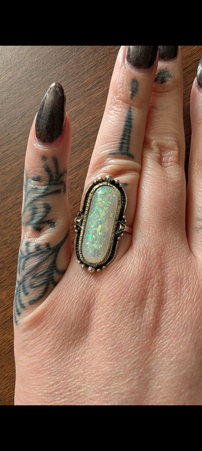 Long oval white confetti faux opal silver tone ring