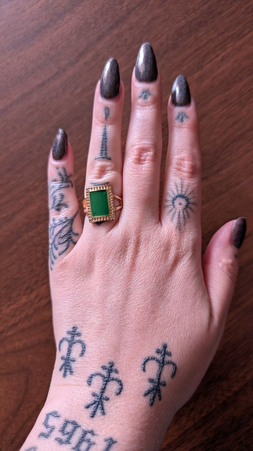 Gold tone and green enamel ring