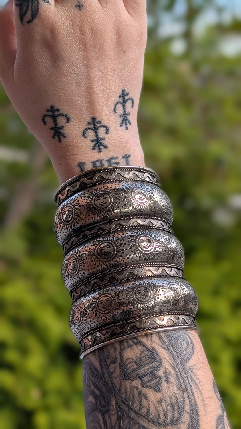 Tibetan sun silver tone manchette bracelet