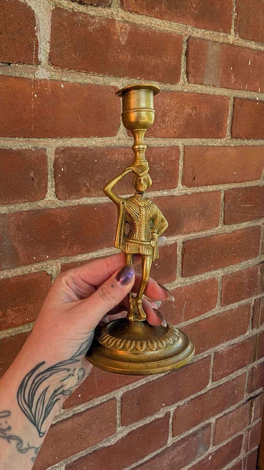 Beheaded jester brass candle holder