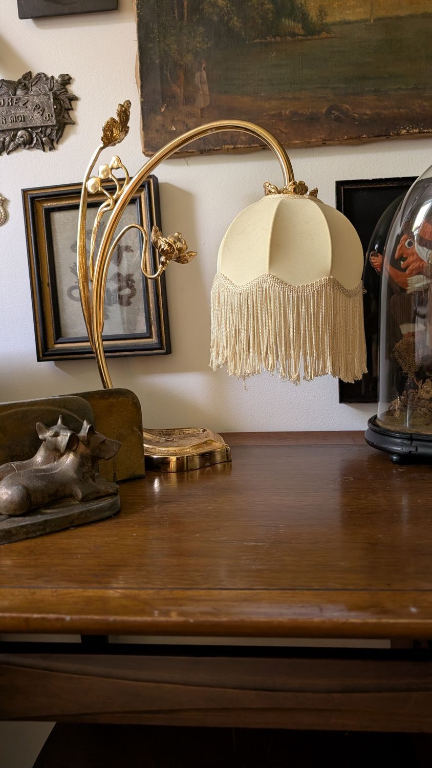 Art nouveau brass floral base with beige abat jour desk lamp