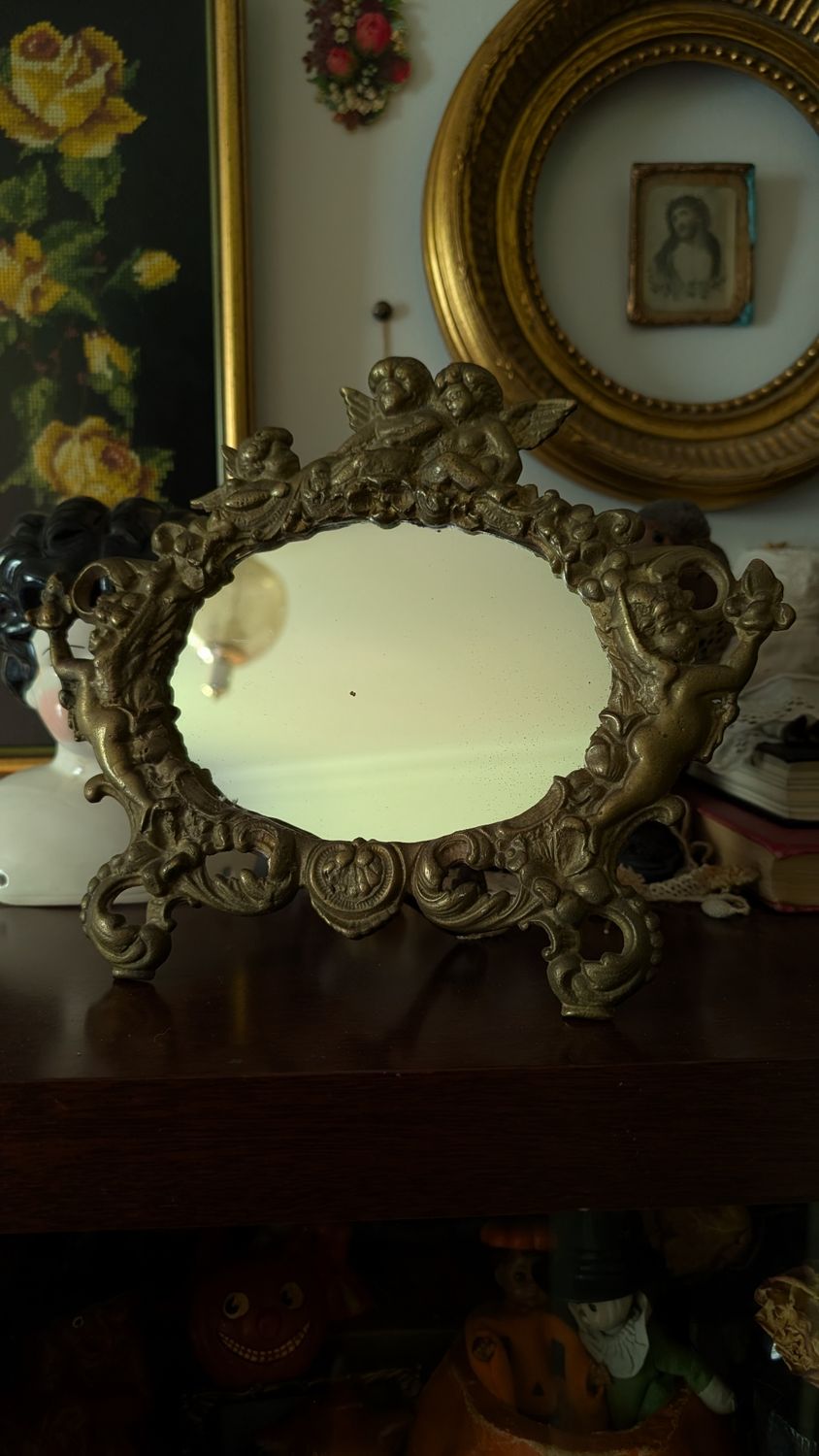 Antique cherub brass table mirror