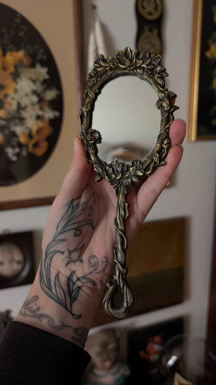 Small hand held mirror