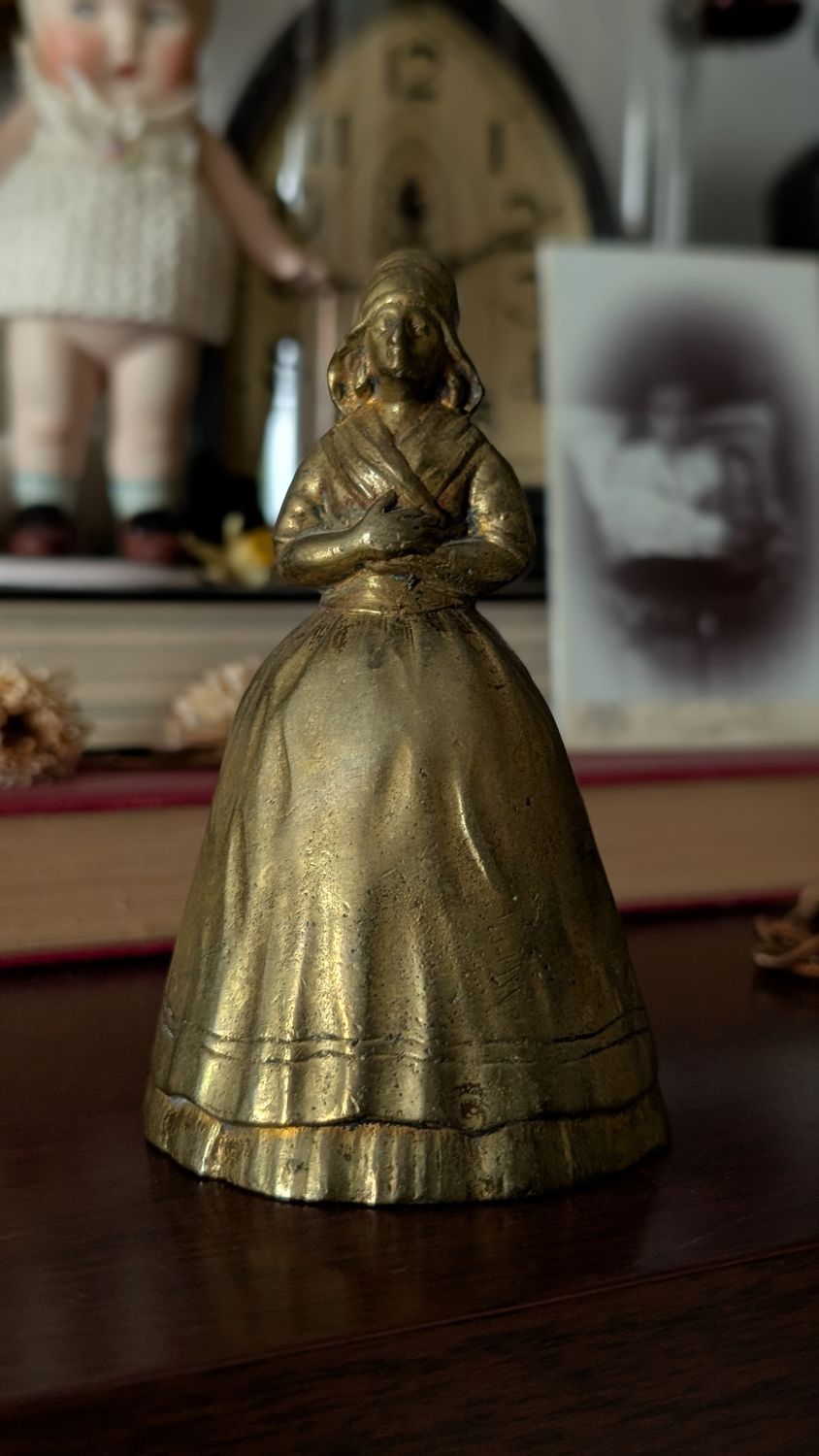 Colonial woman with apron brass bell vintage