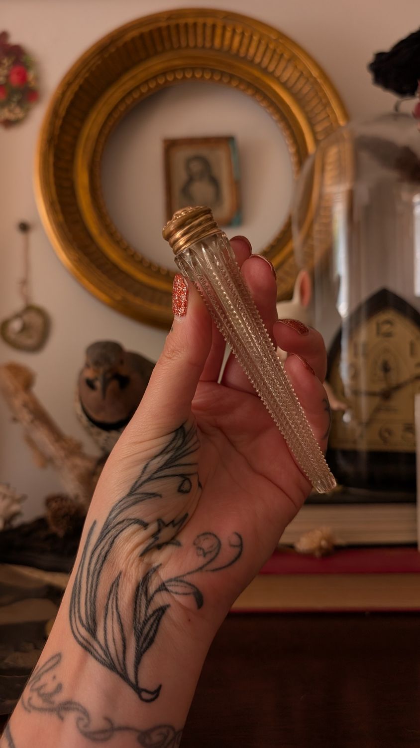 Antique crystal snuff bottle with gold color lid