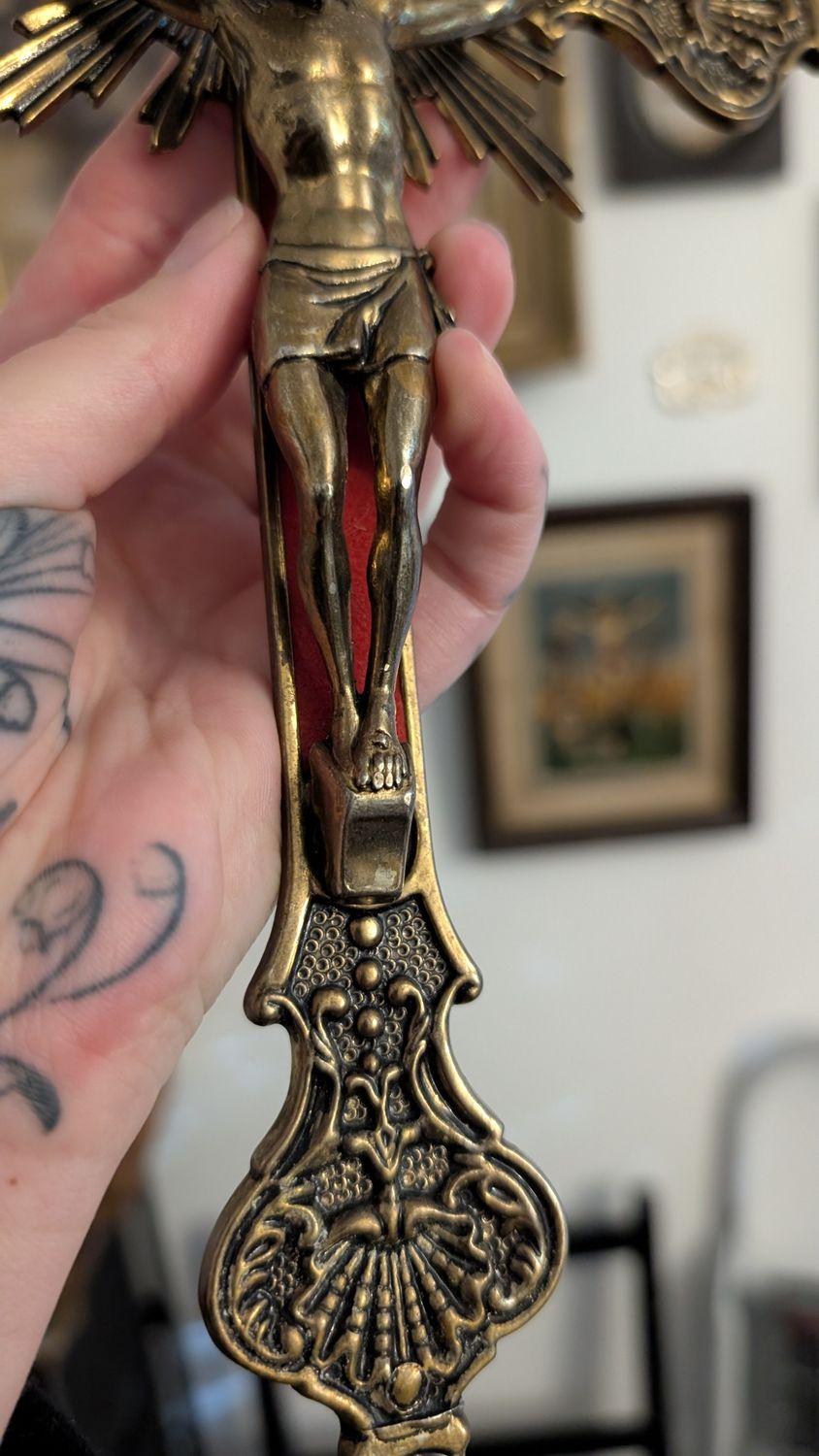 Very ornate crucifix with red background - metal