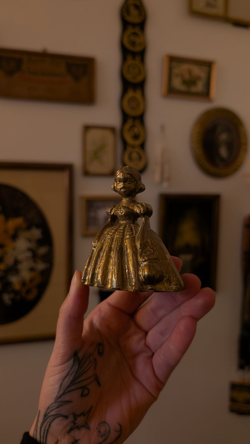 Little brass bell girl with basket
