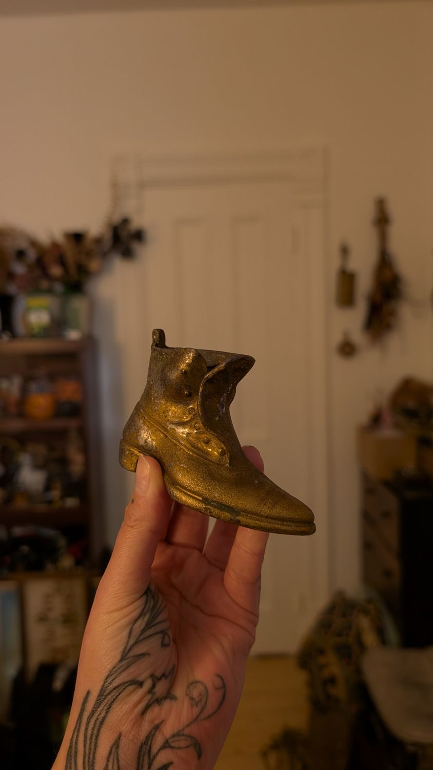 Metal shoe figurine