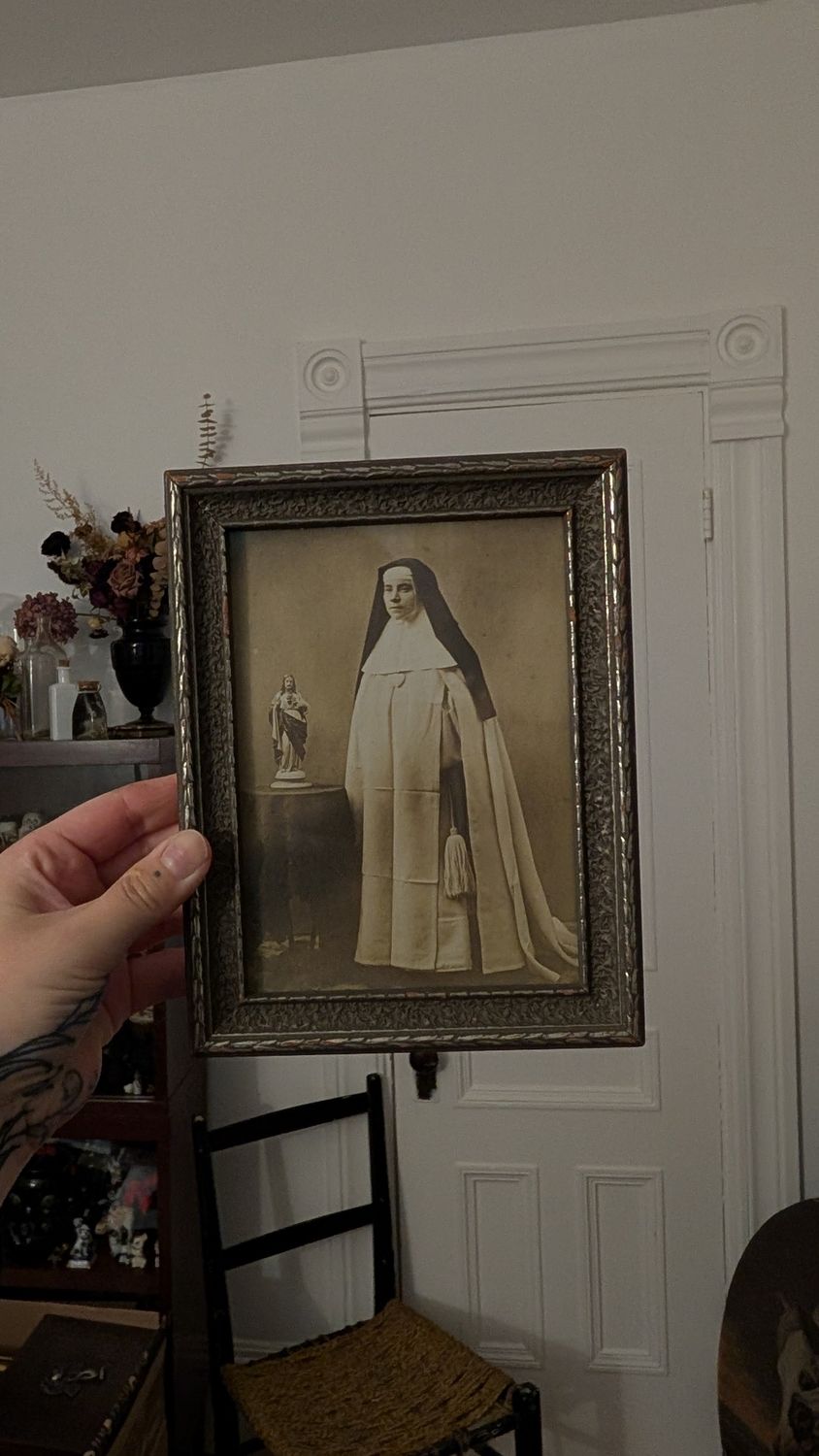 Nun portrait in wood frame