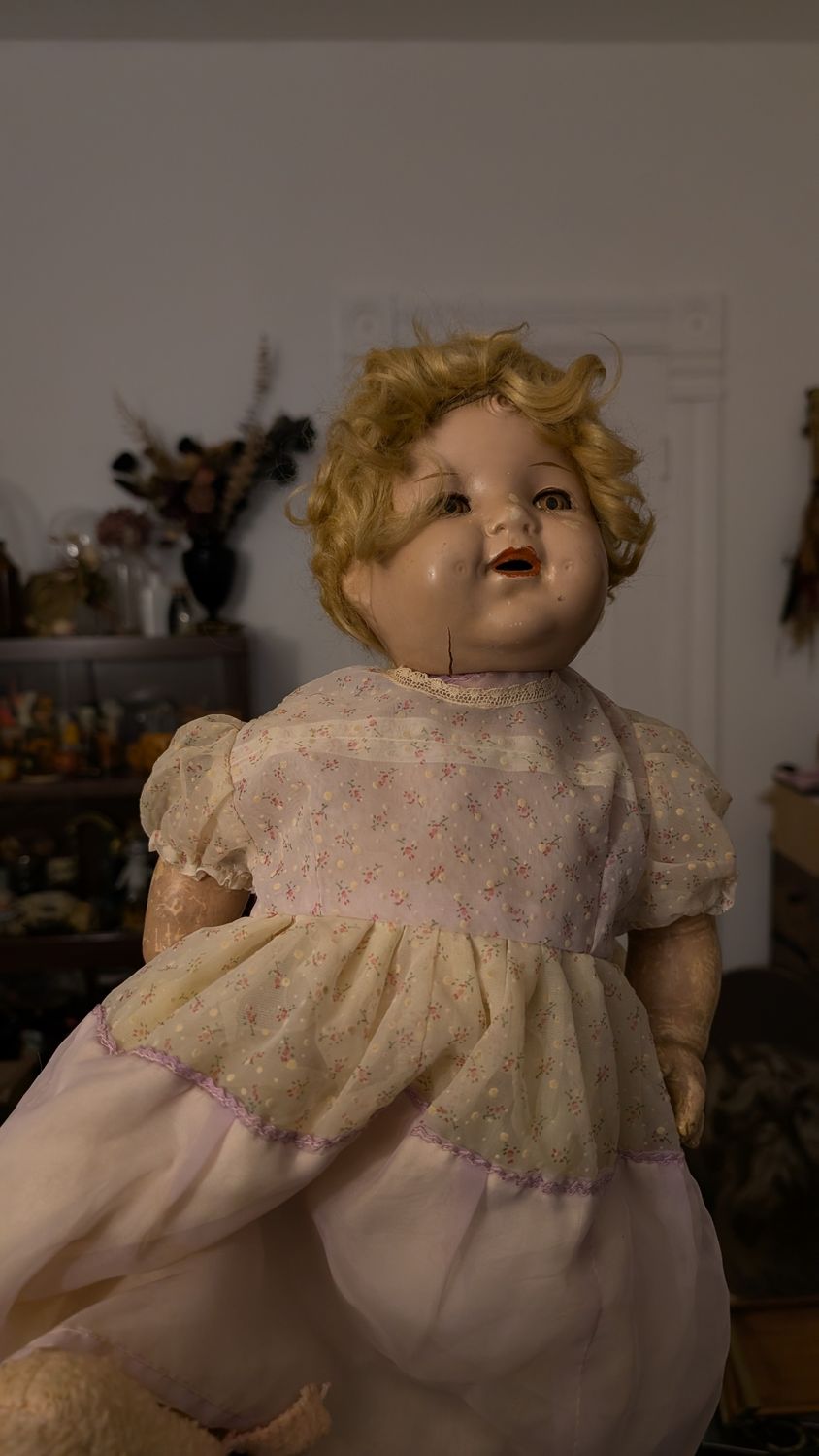 Vintage doll in pinkish dress